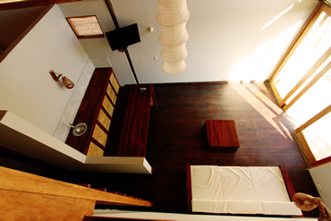 The master bedroom of all our houses looks out on the inviting cool blue waters of the pool